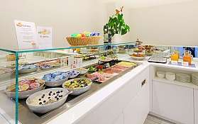 A variety of food items on a buffet table.